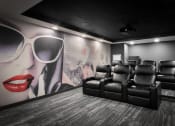 Thumbnail 21 of 53 - a room filled with furniture and a large mural of a woman